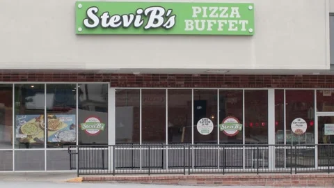 Stevie B's pizza restaurant in a strip m... | Stock Video | Pond5