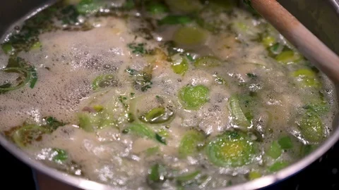 Stew with vegetables is cooking in a saucepan 3 Stock Footage 124680040