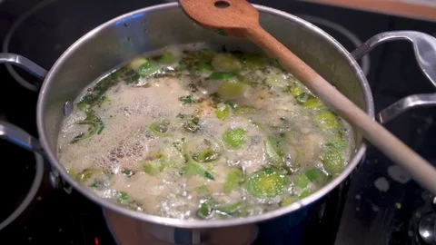 Stew with vegetables is cooking in a saucepan 4 Stock Footage 124680127