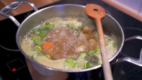 Stew with vegetables is cooking in a saucepan 5 Stock Footage 124680288