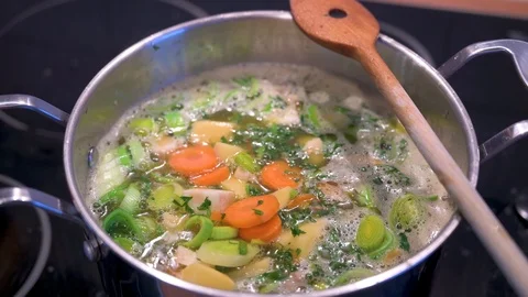 Stew with vegetables is cooking in a saucepan Stock Footage 124680453
