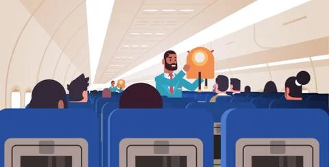 Steward explaining passengers how to use jacket life vest in emergency situat 库存插图