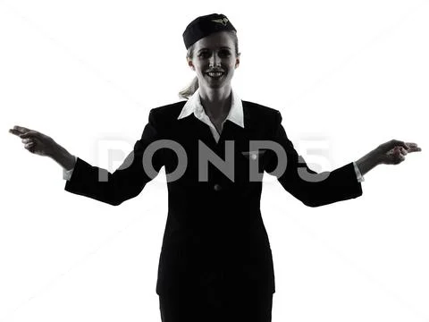 Stewardess cabin crew woman pointing showing isolated silhouette Stock Photos