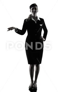Stewardess cabin crew woman pointing showing isolated silhouette Stock Photos
