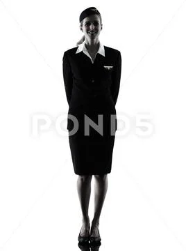Stewardess cabin crew woman standing isolated silhouette Stock Photos
