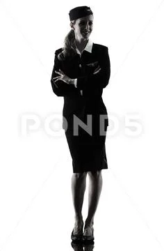 Stewardess cabin crew woman standing isolated silhouette Stock Photos
