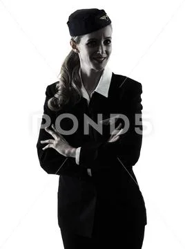 Stewardess cabin crew woman standing isolated silhouette Stock Photos