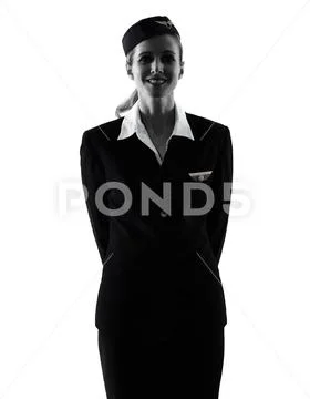 Stewardess cabin crew woman standing isolated silhouette Stock Photos
