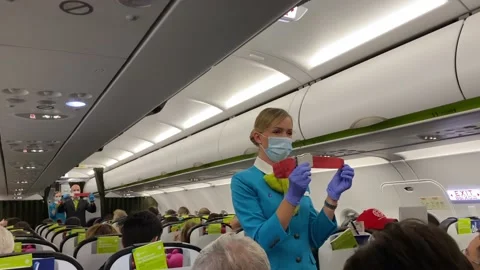Stewardess explains how to use the seat belt Video stock 139745443