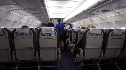 The stewardess serves passengers during the flight. 스톡 동영상 91720169