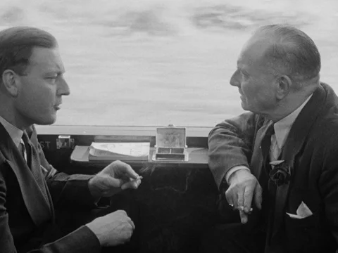 Stewards walking through train and serving passengers, UK 1954 Stock Footage 133275709