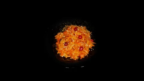 Stewed cabbage with carrots in in the spinning table isolated on black Vidéo 104723012