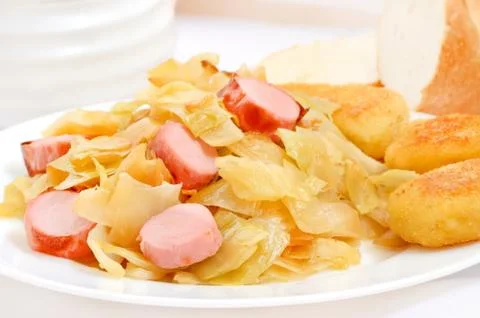 Stewed cabbage with nuggets Stock Photos
