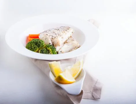Stewed cod and vegetables Stock Photos