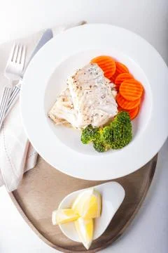 Stewed cod and vegetables Stock Photos