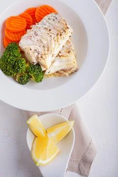 Stewed cod and vegetables Stock Photos