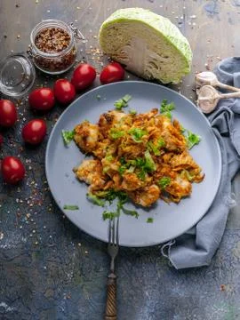 Stewed codfish with brussels sprouts in tomato sauce. Healthy seafood. Ketoge Stock Photos