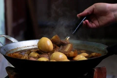 Stewed eggs in a pan placed on a hot stove until boiling Stock Photos