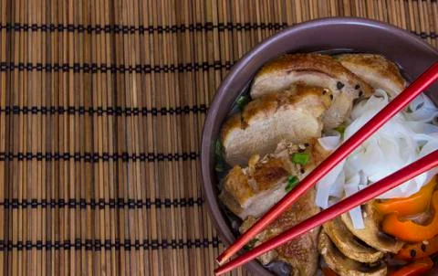 The stewed noodles with duck on bamboo background Stock Photos