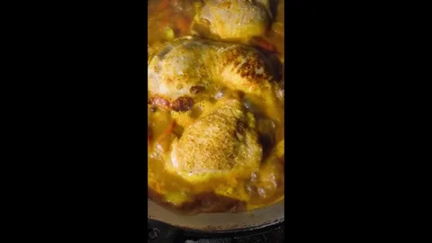 Stewing chopped chickens in pan, in door  Chiangmai  Thailand. Stock Footage 293407732
