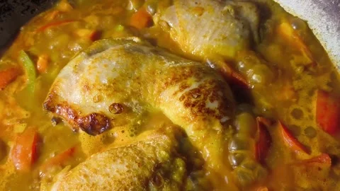 Stewing chopped chickens in pan, in door  Chiangmai  Thailand. Stock Footage 293407749