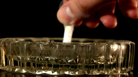 Stewing a cigarette in an ashtray Stock Footage 201325793