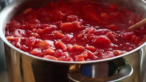 Stewing a large batch of tomatoes for canning Stock Footage 41472640
