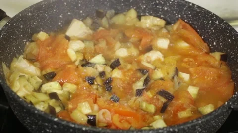 Stewing vegetables in a frying pan Stock Footage 49784014
