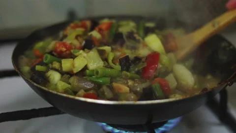 Stewing vegetables in pan close up Stock Footage 123906525