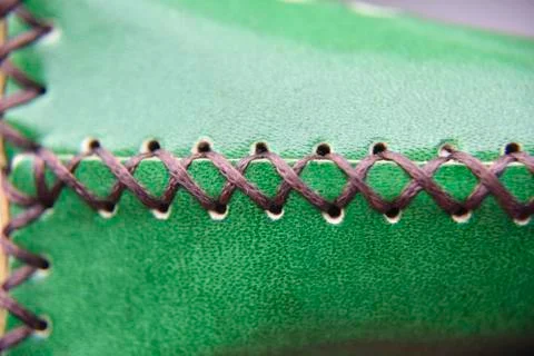 The stich on the green leather Stock Photos