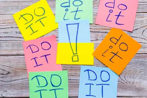 Stick colorful notes inscribed with do it inscriptions Stock Photos