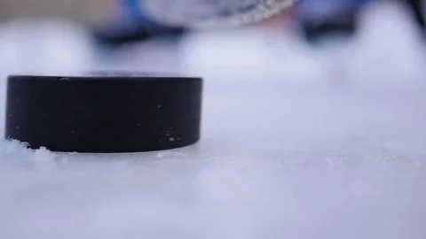 The stick controls dribbling the puck on the ice rink closeup 스톡 동영상 70131604