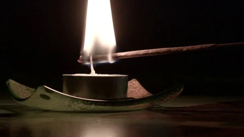 Stick lights a candle Stock Footage 80281794