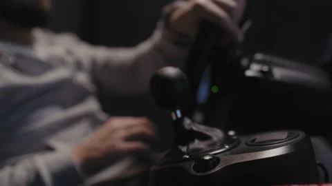 Stick shift and A man using a driving simulator Stock Footage 258391768