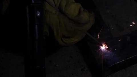 Stick welding errors on a angular L frame, closeup Stock Footage 125031680