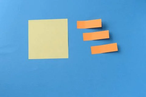 Sticker notes on a blue background with copy space. Business concept Stock Photos