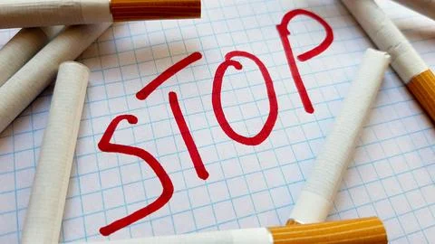 A sticker that says Stop is in a pack of cigarettes. World No Tobacco Day. .. Stock Photos