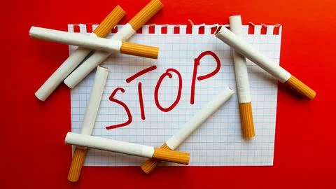 A sticker that says Stop is in a pack of cigarettes. World No Tobacco Day. .. Stock Photos