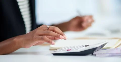 Sticking to the budget is the tricky part. an unrecognizable businesswoman Stock Photos