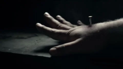 Sticking a nail in a human hand. Stock Footage 8920522