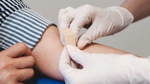 Sticking the patch after passing a blood test. Stock Footage 194172078