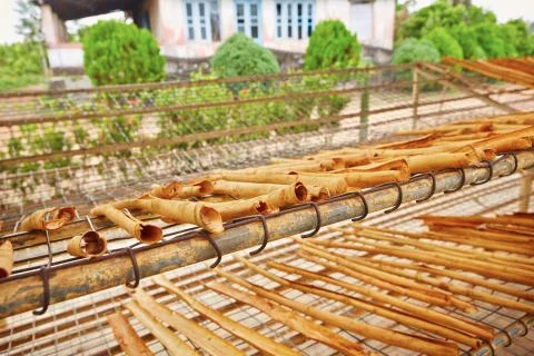 Sticks of cinnamon is drying in small workshop Fotos de archivo
