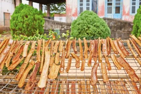 Sticks of cinnamon is drying in small workshop Stock Photos