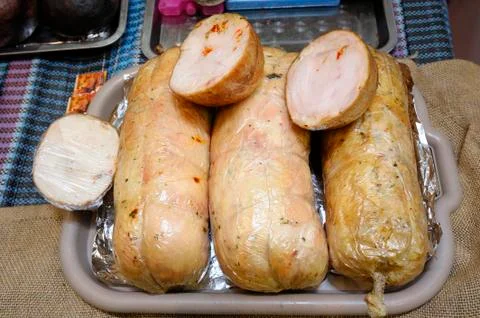 Sticks of meat paste placed on a counter Stock Photos