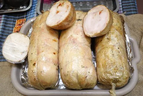 Sticks of meat paste placed on a counter, sausages Stock Photos