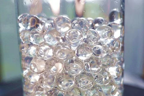 Sticky beads in a plastic container. Stock Photos