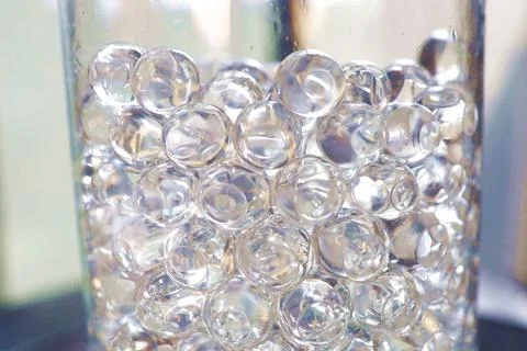 Sticky beads in a plastic container. Stock Photos