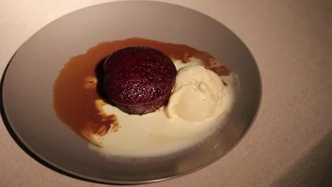 Sticky Date Pudding with Butterscotch Sauce and Vanilla Ice Cream Stock Footage 316895539