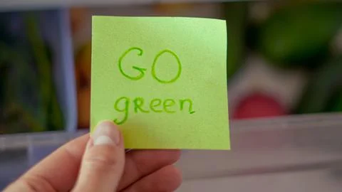 Sticky note on background of fresh vegetables for healthy food message or lab Stock Photos