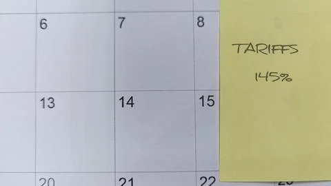 A sticky note on a calendar showing "Tariffs" signals a substantial increas.. Stock Photos